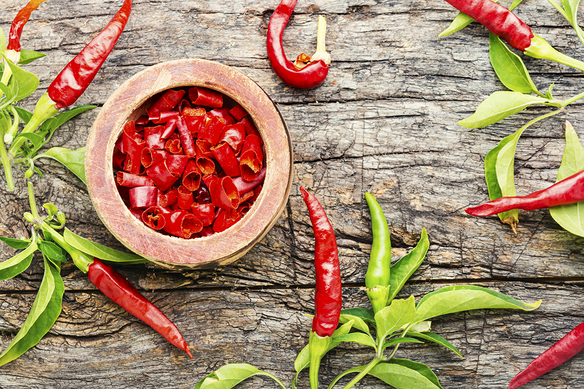 Sliced cayenne pepper in wooden bowl